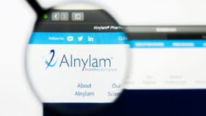 Illustrative Editorial of Alnylam Pharmaceuticals Inc website homepage. Alnylam Pharmaceuticals Inc logo visible on display screen. ALNY stock