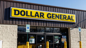 The front of a Dollar General (DG Stock) store on a sunny day.