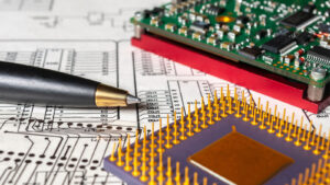 PLAB stock: Electronic board, pen, processor on the background of schematic circuit diagram and photomask for manufacture of printed circuit boards.