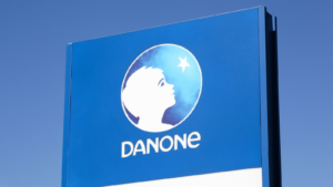 Danone logo on a panel. Danone is a French multinational food-products corporation (DANOY) based in Paris.