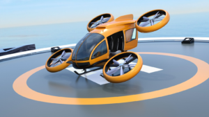 An image of an orange eVTOL sitting on a helipad, the ocean in the background