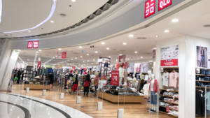 Entrance to Uniqlo store in the shopping mall in Thailand. Uniqlo is a successful global Japanese fast fashion retail brand.