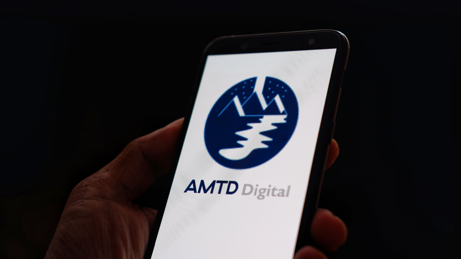 AMTD Digital. Inc logo displayed on smartphone with dark background. AMTD digital (HKD) is intelligent digital financial services platform based in Hong Kong.
