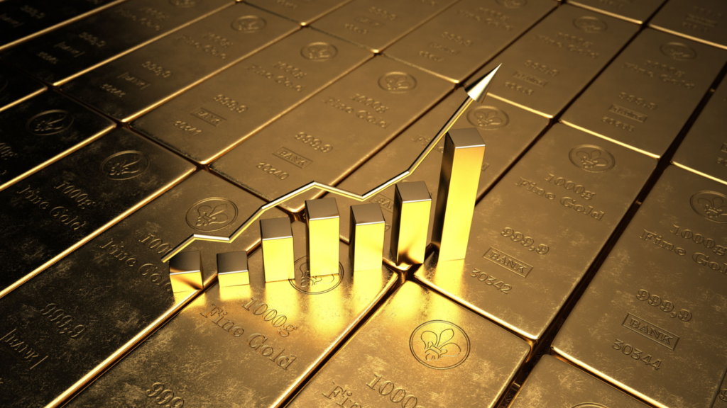 An image of a rising bar graph on top of gold bars, representing gold stocks