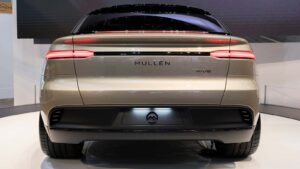 A rear-view shot of a gold Mullen (MULN) Five electric vehicle.