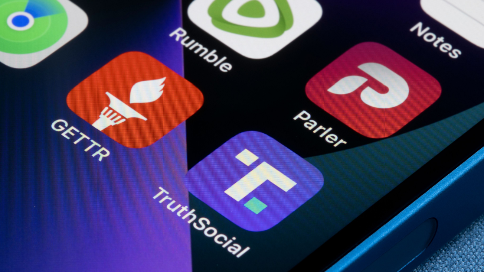 Truth Social (DWAC Stock Fans), Gettr, Rumble (RUM) and Parler app icons are seen on an iPhone. Donald Trump's new social media venture, Truth Social, launched on Feb 20 in Apple's App Store.