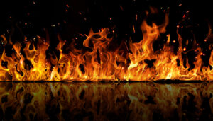 A close-up shot of flames on a black background.