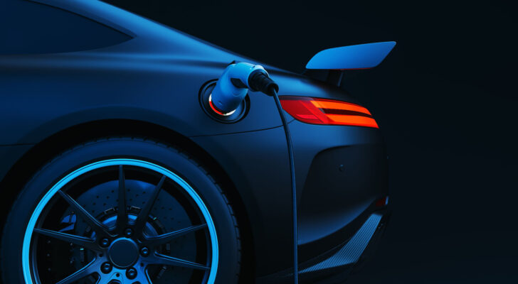 Illustration of blue electric vehicle (EV) charging with dark black background