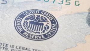 A close-up on the Fed seal stamp on money; US Federal Reserve seal. why are stocks down today