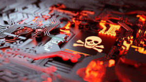 Graphic of skull on computer hardware with red glow beneath hardware. Tech stocks to sell