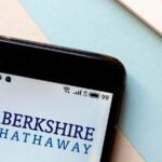 The logo for Berkshire Hathaway displayed on a smartphone screen.