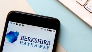 The emblem for Berkshire Hathaway displayed on a smartphone display cowl cowl.