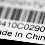 A close up of a label with a barcode that says Made in China.