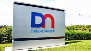 A Diebold Nixdorf (DBD) sign featuring the company logo.