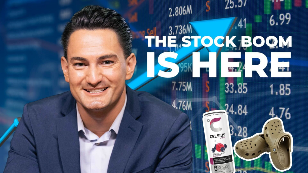 An image of Luke smiling at the camera, with an arrow and candlestick graph rising behind him; the text "the stock boom is here," and an image of a pair of Crocs and a can of Celsius