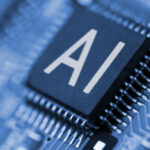 AI stocks to Buy, Close-up of letters "AI" written on a computer chip, symbolizing artificial intelligence and AI stocks. ai chip stocks