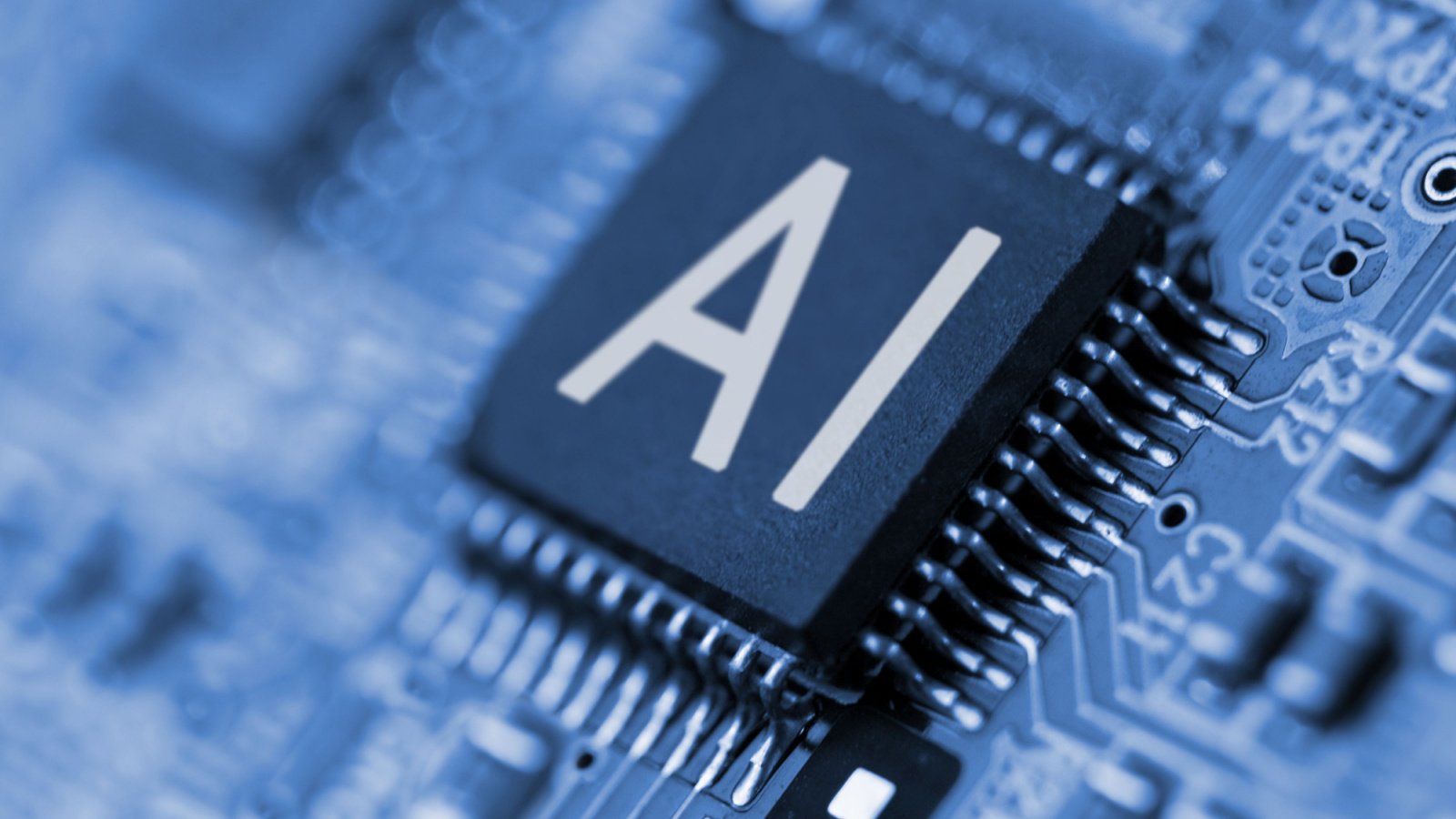 Close-up of letters "AI" written on a computer chip, symbolizing artificial intelligence and AI stocks