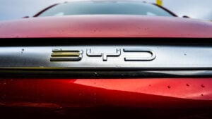 Close-up of BYD (BYDDY) logo on a red car, symbolizing BYDDY stock