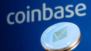 Coinbase (COIN), is an American company that operates a cryptocurrency exchange platform. Ethereum (ETH-USD) coin on the background of the Coinbase inscription.