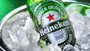 HEINY stock: Bottle of Heineken Lager Beer, the flagship product of Heineken,sitting in a bucket of ice