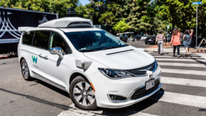 Waymo self-driving car performing tests on a street near Google's offices
