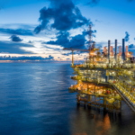 Panorama of Oil and Gas central processing platform in twilight, offshore hard work occupation twenty four working hours. Best oil stocks to buy. Oil & Gas Stocks to Avoid