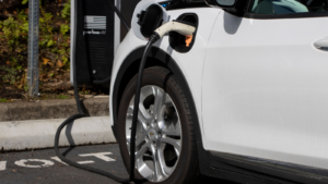 GM Chevy Bolt EV electric car is seen charging at a Volta Charging Station in a parking lot.