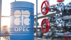 Organization of the Petroleum Exporting Countries (OPEC) logo displayed on baby blue oil barrel next to red valve with steel pipes in background
