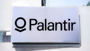 The logo of Palantir Technologies (PLTR) is seen on a billboard. Palantir is a publicly traded American company specializing in big data analytics.