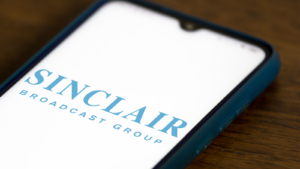 n this photo illustration the Sinclair Broadcast Group (SGBI) logo seen displayed on a smartphone