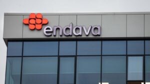 The logo for Endava (DAVA) displayed on an office building.