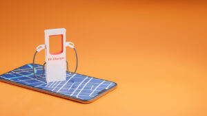 Photorealistic illustration of miniature electric vehicle (EV) charger on top of smart phone against flat bright orange background
