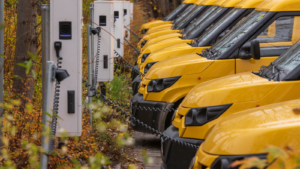 Yellow electric vehicles at the charging station.