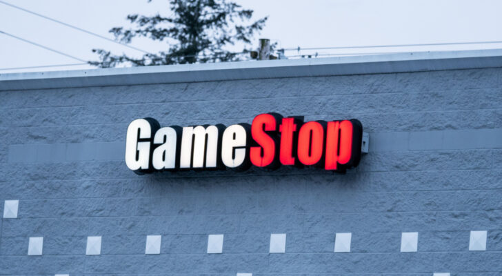 GameStop (GME) sign on side of building in blue early morning light
