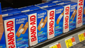 Albuquerque, New Mexico / USA - November 2 2020: Boxes of Band-Aids in Walmart in the pharmacy and over-the-counter medication aisle. Kenvue (KVUE) split from JNJ and now owns the Band-aid brand.