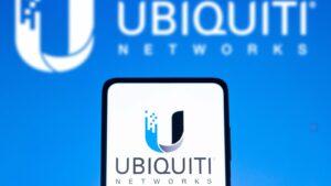 The logo for Ubiquiti (UI) displayed on a smartphone and in the background of the image in blue and white.