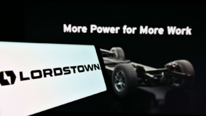 Smartphone with logo of US automotive company Lordstown Motors Corp. (RIDE) on screen in front of business website. Focus on center-right of phone display. Unmodified photo.