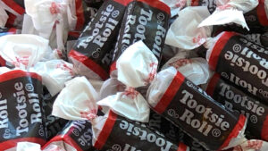 A close-up shot of Tootsie Roll (TR) candies. 