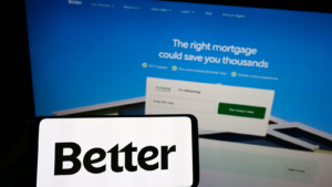 Person holding smartphone with logo of US financial company Better Mortgage (Better.com) on screen in front of website. Focus on phone display. Unmodified photo. BETR stock