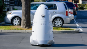 Knightscope (KSCP) security robot patrols an outdoor parking lot