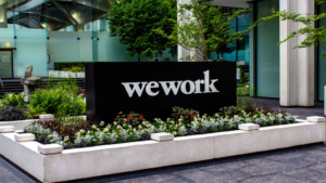 WeWork (WE) sign in front of the building