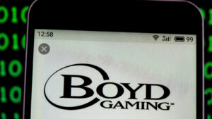 A phone showing the logo for Boyd Gaming (BYD). 