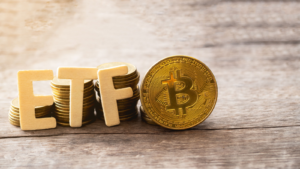 Bitcoin coin with ETF text Put on wooden floor, Concept Entering the Digital Money Fund. Bitcoin ETF