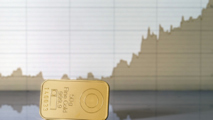 Gold bar on the background of the growth chart. Selective focus.. Gold prices