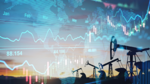 Rise in gasoline prices concept with double exposure of digital screen with financial chart graphs and oil pumps on a field. Oil prices and oil price predictions