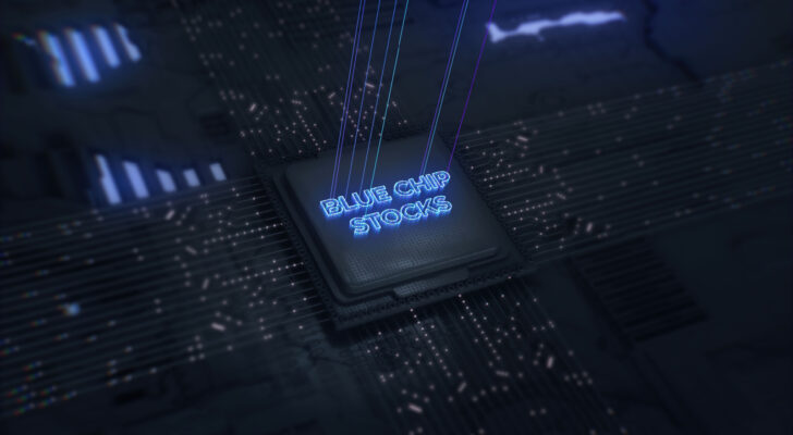 Techy looking chip on circuit board with "blue chip stocks" engraved in blue light on semiconductor chip