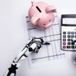 A concept image showing robotic hands with a calculator, financial form, and a pink piggy bank.