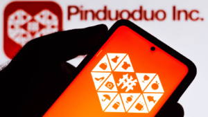 In this photo illustration the Pinduoduo logo seen displayed on a smartphone. PDD stock