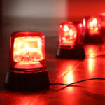 A line of red alert lights flashing while lined up on floor