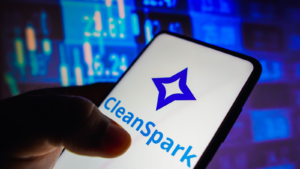 In this photo illustration, the CleanSpark (CLSK) logo is seen on a smartphone screen